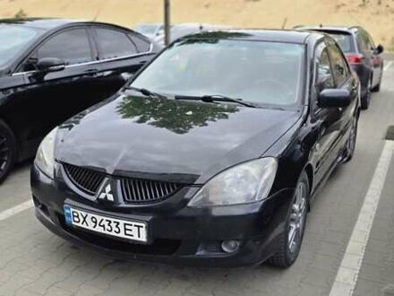 Міцубісі Lancer 2004 у Києві на Automoto.ua Чорний Міцубісі Lancer, об'ємом двигуна 2 л та пробігом 300 тис. км за 4950 $, фото 1 на Automoto.ua