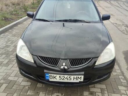 Черный Мицубиси Лансер, объемом двигателя 1.58 л и пробегом 278 тыс. км за 3700 $, фото 1 на Automoto.ua