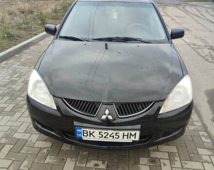 Черный Мицубиси Лансер, объемом двигателя 1.58 л и пробегом 278 тыс. км за 3700 $, фото 1 на Automoto.ua