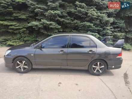 Мицубиси Лансер 2004 в Запорожье на Automoto.ua Черный Мицубиси Лансер, объемом двигателя 1.59 л и пробегом 390 тыс. км за 4400 $, фото 1 на Automoto.ua