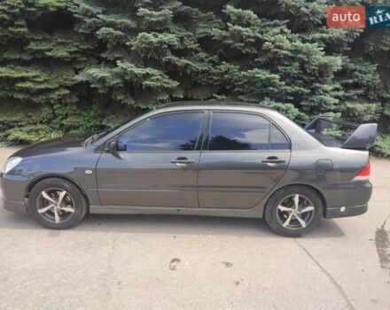 Чорний Міцубісі Lancer, об'ємом двигуна 1.59 л та пробігом 390 тис. км за 4400 $, фото 1 на Automoto.ua