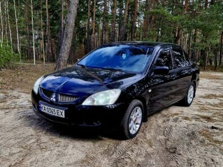 Міцубісі Lancer 2004 у Радомышле на Automoto.ua Чорний Міцубісі Lancer, об'ємом двигуна 1.58 л та пробігом 272 тис. км за 2999 $, фото 1 на Automoto.ua