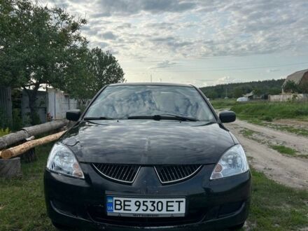 Мицубиси Лансер 2004 в Изюме на Automoto.ua Черный Мицубиси Лансер, объемом двигателя 1.6 л и пробегом 152 тыс. км за 3000 $, фото 1 на Automoto.ua