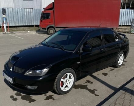 Черный Мицубиси Лансер, объемом двигателя 2 л и пробегом 285 тыс. км за 3499 $, фото 1 на Automoto.ua