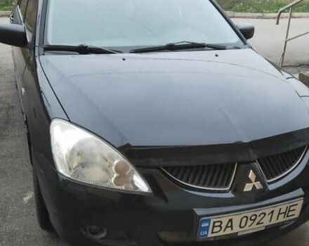 Черный Мицубиси Лансер, объемом двигателя 1.58 л и пробегом 240 тыс. км за 3700 $, фото 1 на Automoto.ua