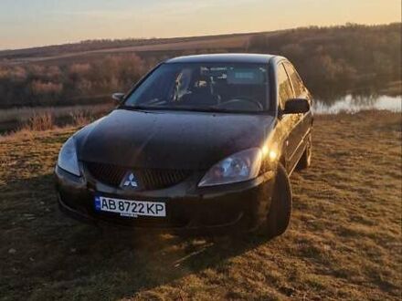 Мицубиси Лансер 2004 в Первомайск на Automoto.ua Черный Мицубиси Лансер, объемом двигателя 2 л и пробегом 384 тыс. км за 4000 $, фото 1 на Automoto.ua