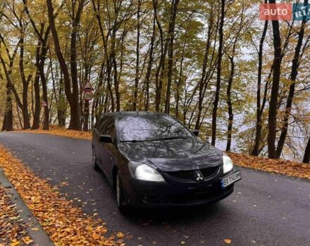 Чорний Міцубісі Lancer, об'ємом двигуна 2 л та пробігом 296 тис. км за 5100 $, фото 1 на Automoto.ua