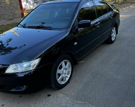 Чорний Міцубісі Lancer, об'ємом двигуна 1.6 л та пробігом 263 тис. км за 4200 $, фото 1 на Automoto.ua