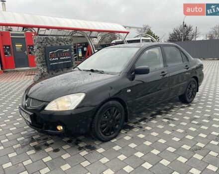 Чорний Міцубісі Lancer, об'ємом двигуна 1.58 л та пробігом 290 тис. км за 3900 $, фото 1 на Automoto.ua
