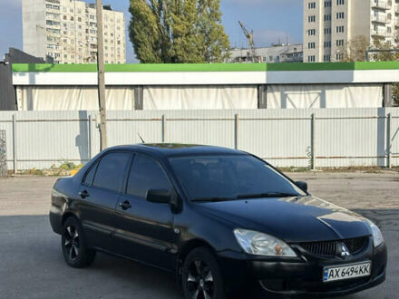 Мицубиси Лансер 2004 в Харькове на Automoto.ua Черный Мицубиси Лансер, объемом двигателя 1.58 л и пробегом 230 тыс. км за 2899 $, фото 1 на Automoto.ua