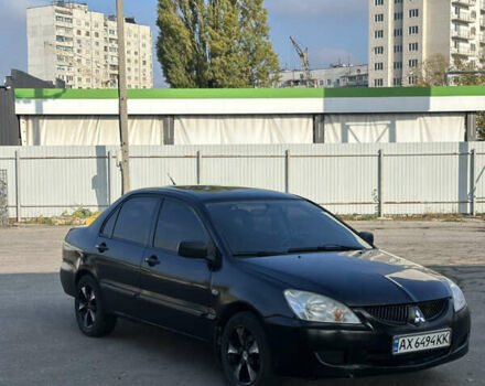 Міцубісі Lancer 2004 у Харкові на Automoto.ua Чорний Міцубісі Lancer, об'ємом двигуна 1.58 л та пробігом 230 тис. км за 2899 $, фото 1 на Automoto.ua