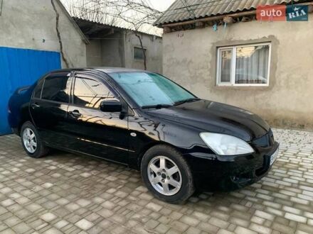 Черный Мицубиси Лансер, объемом двигателя 1.6 л и пробегом 121 тыс. км за 3900 $, фото 1 на Automoto.ua