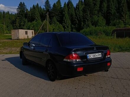 Мицубиси Лансер 2004 в Дрогобыче на Automoto.ua Черный Мицубиси Лансер, объемом двигателя 1.6 л и пробегом 380 тыс. км за 3550 $, фото 1 на Automoto.ua