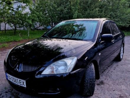 Міцубісі Lancer 2004 у Радомышле на Automoto.ua Чорний Міцубісі Lancer, об'ємом двигуна 1.6 л та пробігом 272 тис. км за 3200 $, фото 1 на Automoto.ua