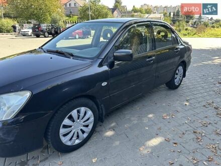 Чорний Міцубісі Lancer, об'ємом двигуна 1.58 л та пробігом 463 тис. км за 3900 $, фото 1 на Automoto.ua