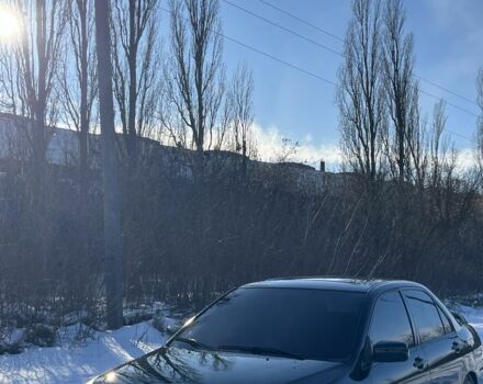 Черный Мицубиси Лансер, объемом двигателя 2 л и пробегом 295 тыс. км за 3600 $, фото 1 на Automoto.ua