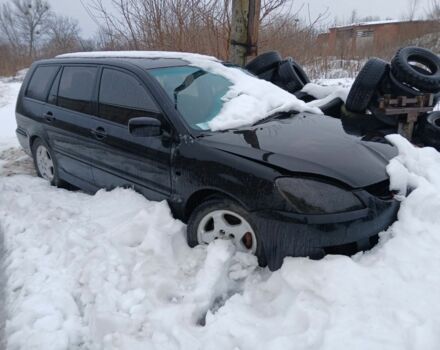 Черный Мицубиси Лансер, объемом двигателя 2 л и пробегом 300 тыс. км за 1650 $, фото 1 на Automoto.ua