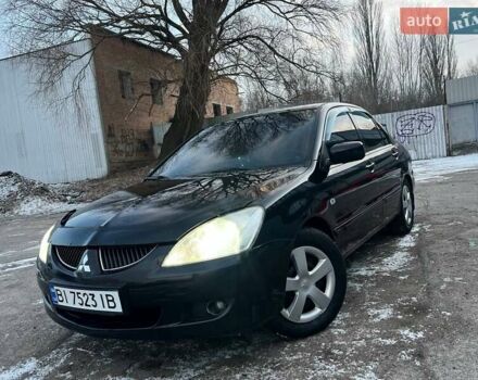 Черный Мицубиси Лансер, объемом двигателя 1.58 л и пробегом 266 тыс. км за 3600 $, фото 1 на Automoto.ua