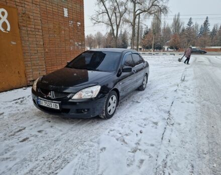 Черный Мицубиси Лансер, объемом двигателя 1.6 л и пробегом 230 тыс. км за 4100 $, фото 1 на Automoto.ua