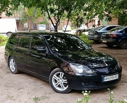 Черный Мицубиси Лансер, объемом двигателя 2 л и пробегом 231 тыс. км за 5350 $, фото 1 на Automoto.ua