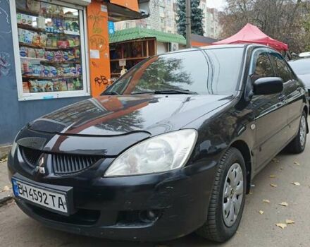 Черный Мицубиси Лансер, объемом двигателя 1.58 л и пробегом 350 тыс. км за 3400 $, фото 1 на Automoto.ua