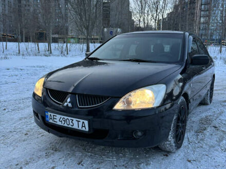 Черный Мицубиси Лансер, объемом двигателя 1.58 л и пробегом 228 тыс. км за 4599 $, фото 1 на Automoto.ua