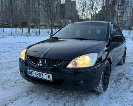 Чорний Міцубісі Lancer, об'ємом двигуна 1.58 л та пробігом 228 тис. км за 4599 $, фото 1 на Automoto.ua