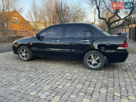Мицубиси Лансер 2004 в Харькове на Automoto.ua Черный Мицубиси Лансер, объемом двигателя 1.58 л и пробегом 220 тыс. км за 3900 $, фото 1 на Automoto.ua