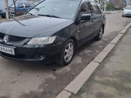 Черный Мицубиси Лансер, объемом двигателя 1.58 л и пробегом 230 тыс. км за 3600 $, фото 1 на Automoto.ua