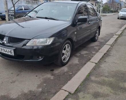 Чорний Міцубісі Lancer, об'ємом двигуна 1.58 л та пробігом 230 тис. км за 3600 $, фото 1 на Automoto.ua