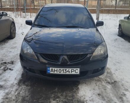 Чорний Міцубісі Lancer, об'ємом двигуна 2 л та пробігом 231 тис. км за 5199 $, фото 1 на Automoto.ua