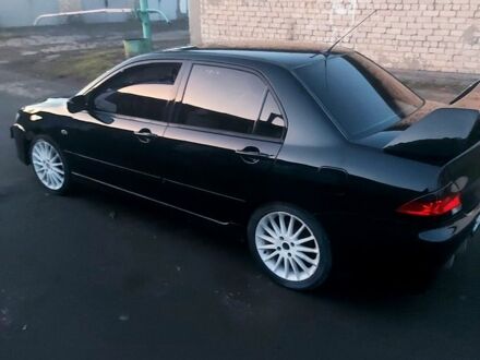 Чорний Міцубісі Lancer, об'ємом двигуна 16 л та пробігом 220 тис. км за 5000 $, фото 1 на Automoto.ua