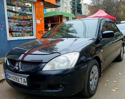 Черный Мицубиси Лансер, объемом двигателя 1.6 л и пробегом 345 тыс. км за 4800 $, фото 1 на Automoto.ua