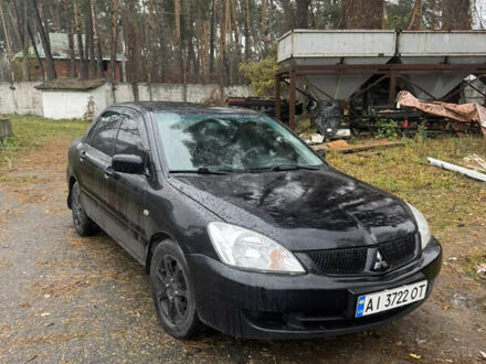 Черный Мицубиси Лансер, объемом двигателя 1.58 л и пробегом 264 тыс. км за 4600 $, фото 1 на Automoto.ua