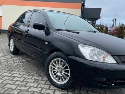 Чорний Міцубісі Lancer, об'ємом двигуна 1.6 л та пробігом 240 тис. км за 3499 $, фото 1 на Automoto.ua