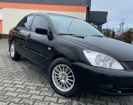 Черный Мицубиси Лансер, объемом двигателя 1.6 л и пробегом 240 тыс. км за 3499 $, фото 1 на Automoto.ua