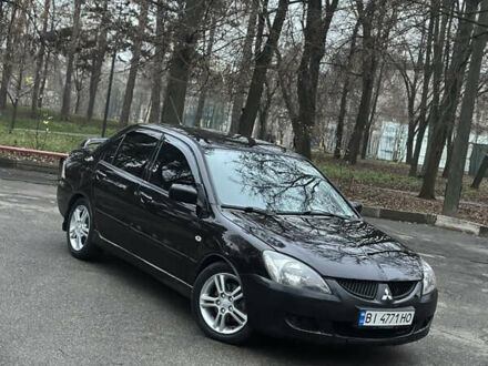 Чорний Міцубісі Lancer, об'ємом двигуна 2 л та пробігом 250 тис. км за 3999 $, фото 1 на Automoto.ua