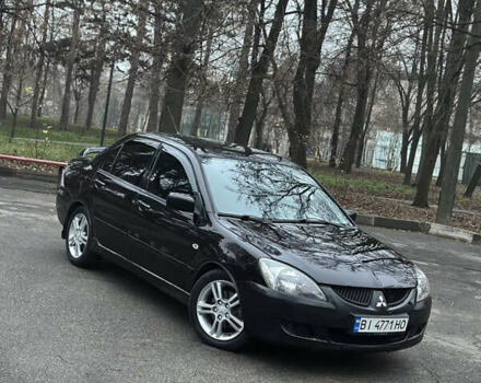 Чорний Міцубісі Lancer, об'ємом двигуна 2 л та пробігом 250 тис. км за 3999 $, фото 1 на Automoto.ua