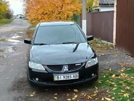 Черный Мицубиси Лансер, объемом двигателя 1.58 л и пробегом 261 тыс. км за 4400 $, фото 1 на Automoto.ua