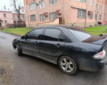 Черный Мицубиси Лансер, объемом двигателя 2 л и пробегом 275 тыс. км за 2599 $, фото 1 на Automoto.ua