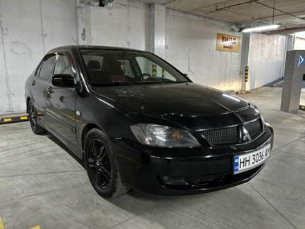 Черный Мицубиси Лансер, объемом двигателя 2 л и пробегом 261 тыс. км за 2700 $, фото 1 на Automoto.ua