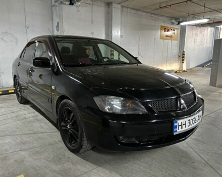 Черный Мицубиси Лансер, объемом двигателя 2 л и пробегом 261 тыс. км за 2700 $, фото 1 на Automoto.ua