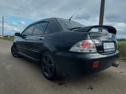 Чорний Міцубісі Lancer, об'ємом двигуна 2 л та пробігом 225 тис. км за 4400 $, фото 1 на Automoto.ua