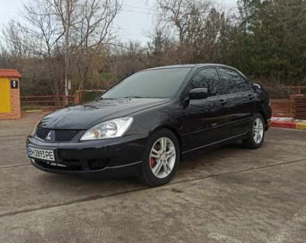 Чорний Міцубісі Lancer, об'ємом двигуна 2 л та пробігом 267 тис. км за 5200 $, фото 1 на Automoto.ua