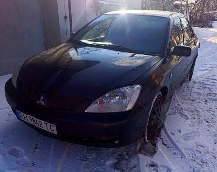 Черный Мицубиси Лансер, объемом двигателя 1.6 л и пробегом 300 тыс. км за 2200 $, фото 1 на Automoto.ua