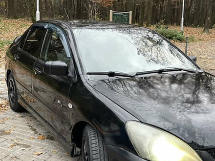 Чорний Міцубісі Lancer, об'ємом двигуна 1.6 л та пробігом 200 тис. км за 3000 $, фото 1 на Automoto.ua