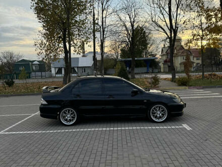 Черный Мицубиси Лансер, объемом двигателя 2 л и пробегом 270 тыс. км за 5200 $, фото 1 на Automoto.ua