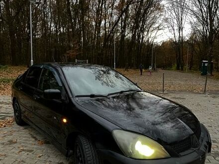 Чорний Міцубісі Lancer, об'ємом двигуна 1.6 л та пробігом 200 тис. км за 3000 $, фото 1 на Automoto.ua