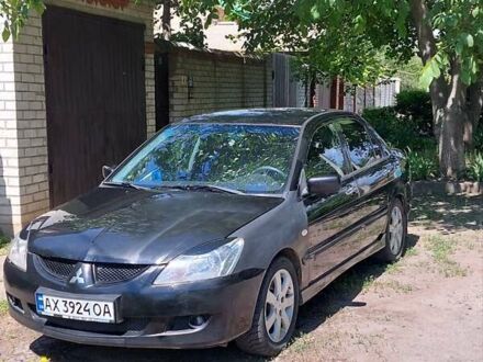 Чорний Міцубісі Lancer, об'ємом двигуна 1.58 л та пробігом 245 тис. км за 3999 $, фото 1 на Automoto.ua