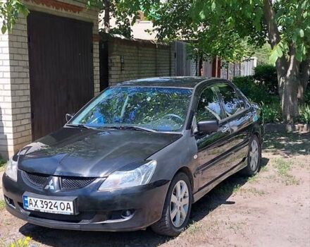 Чорний Міцубісі Lancer, об'ємом двигуна 1.58 л та пробігом 245 тис. км за 3999 $, фото 1 на Automoto.ua